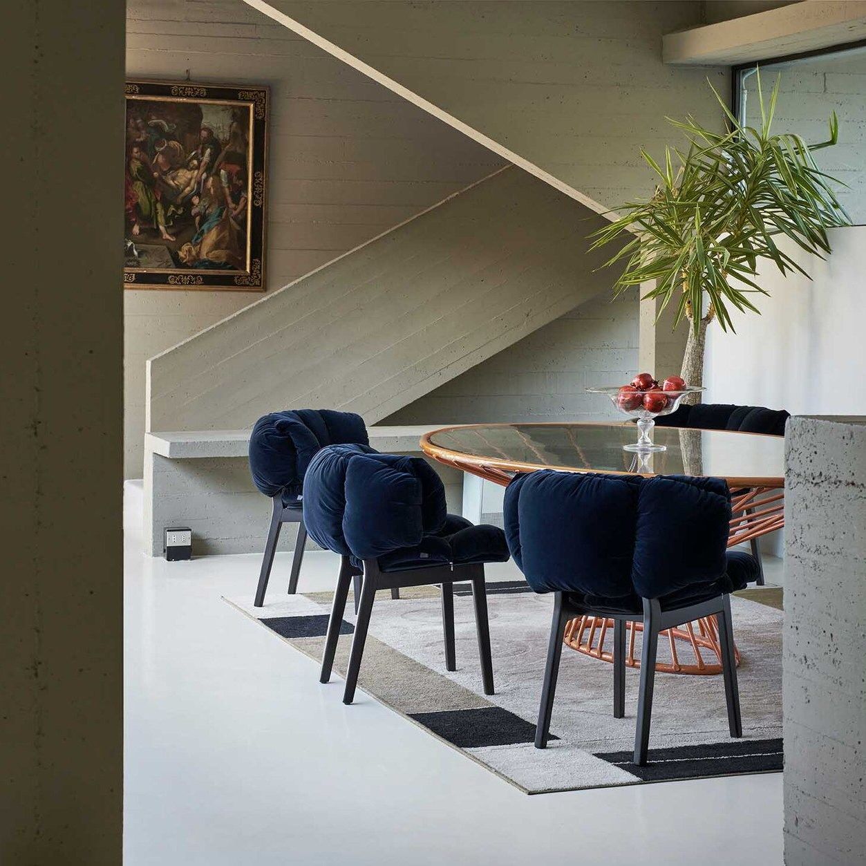   BlueVelvet  The armchairs of the Campania brothers around the iron and glass table by the architect Alberto Paoli. 
